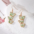 Golden butterfly drop earrings with clear resin layers and green dried flowers - Green Butterfly