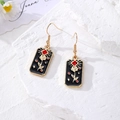 Star Moon Tarot earrings in gold metal with black enamel rose pattern and hook design - Rose