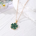 Elegante collana a quadrifoglio dorata con pendente in smalto verde e cristallo nero centrale - Trifoglio Verde