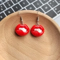 Quirky resin red lip drop earrings featuring a sexy biting lip design on a wooden tray - Biting Red Lips