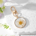 Handmade clear resin keychain with white daisy flower and gold leaf on stone - White Daisy