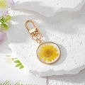 Bohemian key ring with yellow daisy dried flower in clear resin and gold metal frame - Yellow Daisy