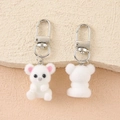 Front and back view of cute white flocked bear pendants with silver metal clasps - White Plush Bear