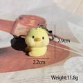 Detailed view of yellow flocked chick keychain showing 2.9cm height and 11.8g weight - Flocked Yellow Duck