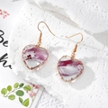 Detail of heart resin earrings with purple gradient and gold wire-wrapped edges - Gradient Purple