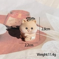 Macro shot of a flocked animal keychain with a white bow, size 2.8cm and 11.4g weight - Flocked Brown Bear