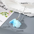 Detail of blue flocked axolotl charm showing plush texture and white lanyard attachment - Blue Axolotl (MR107)