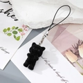Detailed view of a black flocked kitten charm with silver lobster clasp and strap - Black Cat