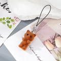Detail of reddish-brown flocked cat keychain with soft furry texture and black metal lanyard - Brown Cat