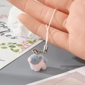 Close-up of soft pink and grey flocked bird keychain with plush texture and white lanyard - Pink and Grey Chick (1MR74)