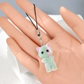 Detailed macro view of a fuzzy green kitten charm with a soft flocked texture and silver clip - Green Gradient Cat