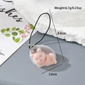 Pink flocked resin animal keychain in sleeping pose with soft texture and hanging strap - MR42 Side Lying Hedgehog