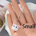 Close-up of white plush cat charm with silver lobster clasp and white nylon lanyard - Small White Cat Head