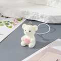 Cute white flocked teddy bear keychain holding a pink heart with a silver metal clasp - MR64 White Bear Holding Heart
