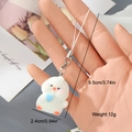 Detail showing dimensions of white flocked resin chick keychain with a blue heart charm - White Chick Style (4MR17)