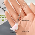 Detail view of a white flocked bird charm with pink accents and silver lobster clasp - White and Pink Bird (18MR09)