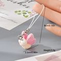 Detail showing the 8cm cord and pink resin butterfly charm on a white phone lanyard - Pink Butterfly (14MR46)