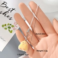 Detail view of small yellow plush chick pendant with metallic clasp and white woven strap - Yellow Long Haired Chick (1MR33)
