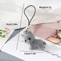 Detailed view of a 9cm grey flocked kitten keychain with metal clip on a white stone base - Grey Laying Cat