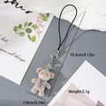 Close-up of a 4.13 inch flocked brown bear keychain with a bow and silver metal clasp - MR18 Brown Bear