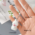 Detail view of a white flocked rabbit charm with size dimensions and silver clasp - White Rabbit with Pink Ball (15MR110)