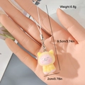 Close-up of yellow flocked animal keychain with detailed weight and size measurements - Yellow Dog (9MR14)