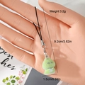 Detail view of a 3.2g green flocked dinosaur keychain charm showing size and weight - Green Cute Monster Style (3MR65)