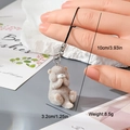 Detail view of grey flocked resin bear charm with sizing data and metal connector - Grey Bear (15MR20)