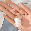Cute white flocked bear keychain accessory with pink crossbody bag for phones or bags - White Bear with Bag (20MR62)