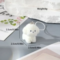 Detail shot of white flocked puppy keychain with silver clasp and size markings - Standing Dog (MR21)