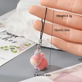 Detailed close-up of a pink flocked animal charm with a soft texture and black lanyard - Pink Capybara Horse Style (12MR65)