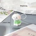 Detail showing white plush puppy dog charm wearing a green sweater with size measurements - Dog in Green Sweater (MR84)