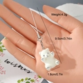 Detail view of cute flocked polar bear keychain with dimensions 9.5cm length and 4.3g weight - Polar Bear Prone Style (19MR19)