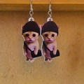 Detailed view of fun acrylic earrings featuring cartoon cats with hats and bags - Cat with Hat and Bag Shape (G)