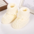 Hand-knitted cream white baby booties made of soft wool yarn for newborn infants - Beige