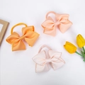 Set de tres diademas con lazos bordados en naranja y rosa para bebés y niñas - Estilo de Tonos Cálidos