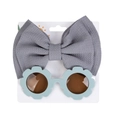 Kids flower sunglasses with grey bow headband set on a white display card - Light Blue