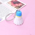 Creative blue and yellow shuttlecock keychain accessory with silver ring on pink background - Sky Blue