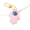 Rosa Hamsa-Hand Schlüsselanhänger mit blauem Evil-Eye-Anhänger und Strasssteinen - Rosa Hand der Fatima