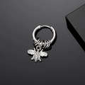 Detailed macro view of silver steel hoop earring with honey bee charm and small rings - Silver Bee