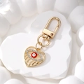 Portachiavi a cuore occhio del male dorato con cristalli scintillanti e smalto rosso - Cuore Occhio Rosso / Rosso