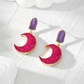 Detailed view of bohemian gold earrings with purple resin and rose red crescent charms - Moon Style