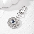 Detail of vintage silver Evil Eye keychain with hollow patterns and sparkling rhinestones - Silver Gray Eye