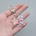 Detail of pink translucent star and pearlized rabbit keychain with silver lobster clasp - Transparent Pink