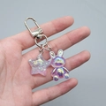 Detail of colorful resin rabbit charm and purple glitter star on silver lobster clasp - Amethyst