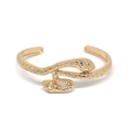 Detailed close-up of golden snake scale texture and dual head design on punk metal bangle - Double Head Snake Open Cuff / Gold Caduceus