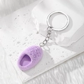 Creative purple mini slipper keychain with soft flocking on a minimalist stone background - Slipper / Purple