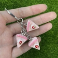 Detail view of mini strawberry layer cake charms with silver metal keychain clips - Pink Cream Cake