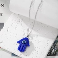 Evil eye Hamsa hand necklace with blue resin pendant and silver chain for women - Sapphire Blue