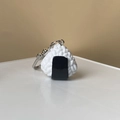 Macro view of a 3D resin rice ball keychain with realistic rice texture and seaweed - Triangle Rice Ball
